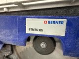 a close up of a blue machine with a label on it