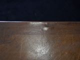 a close up of a wooden table with a black background