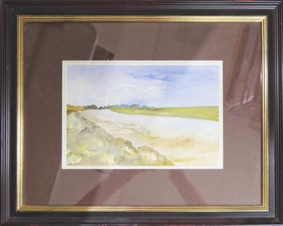 framed watercolor painting of a landscape in a brown frame