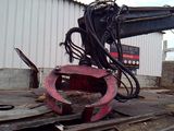 a large machine that is sitting on a pile of wood