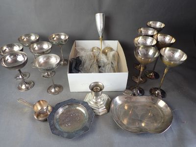 a lot of silver items that are on a table
