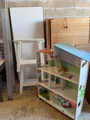 a doll house that is in the corner of a room
