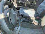 a car dashboard with a steering wheel and a dash board
