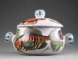 a white bowl with a fish design on it