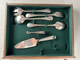 six silver spoons and a knife in a box