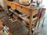 a wooden table with a bunch of items on top of it