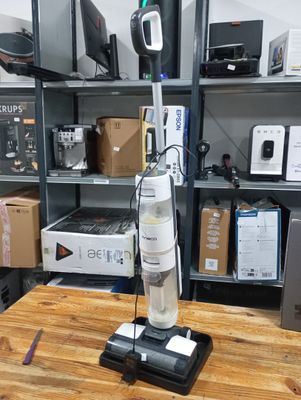 a vacuum that is sitting on a table in a room