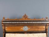 a wooden bed with a wooden headboard and a wooden foot board