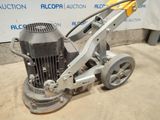 a close up of a machine that is sitting on the ground