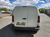 a white van that is parked in a parking lot
