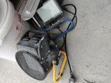 a bucket of water and a radio on the ground