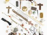 a white table with a bunch of jewelry on it