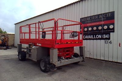 a picture of a red scissor parked in front of a building