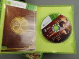 the xbox game is in a green case with a gold disc