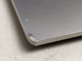 a close up of a silver laptop on a table