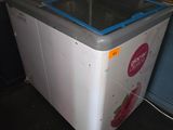 a washing machine that is sitting on the floor