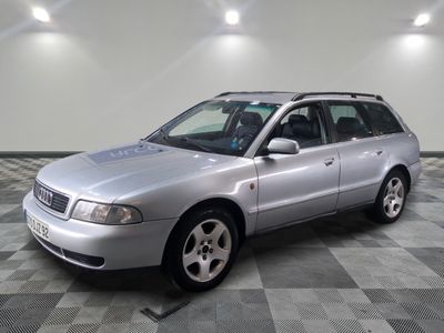 a picture of a silver car parked in a garage