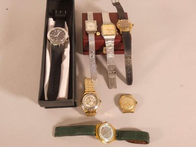 a box with a watch, a watch, a watch, a watch, a watch, a watch, a watch, a watch, and a watch