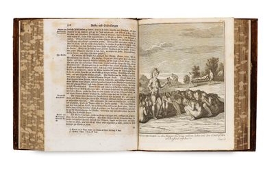 an open book with a picture of a group of people in a field