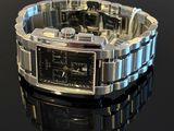 a close up of a wrist watch on a black surface