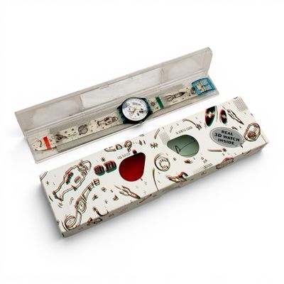 a watch and a pen in a box on a table