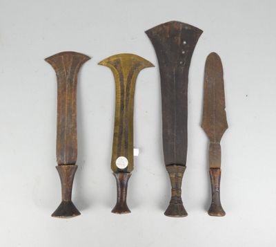 three different types of knives on a white surface