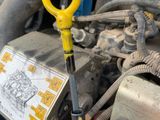 a close up of a car engine with a yellow key on it
