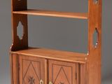 an antique wooden bookcase with two doors and two drawers
