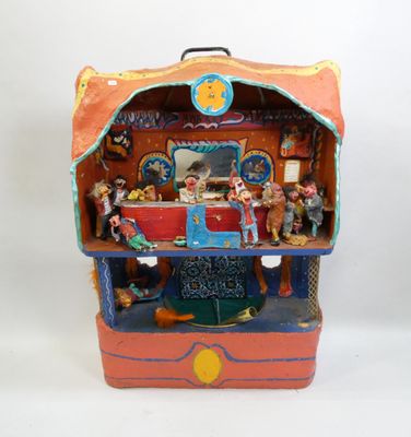 a small doll house in the shape of a suitcase