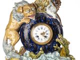 a clock that has a lion and a dragon on top of it