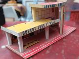 a small model of a building made out of cardboard