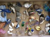 a cardboard box filled with assorted glass ornaments