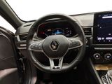 the interior of a car with a steering wheel and a touch screen