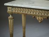 marble topped console table with carved legs and a marble top