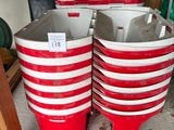 four red and white buckets stacked on top of each other