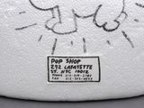 a white toilet paper with a drawing of a cat on it