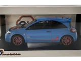 blue toy car in a white box with red rims