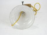 a small glass object with a rope on it