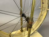 a close up of a bicycle wheel on a stand