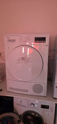 a washing machine and a dryer sitting on top of each other