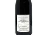 a bottle of wine that is sitting on a table