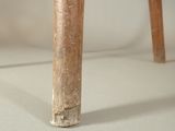 a close up of a wooden chair with a white background