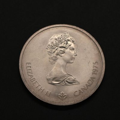 gros plan d'une pièce de monnaie sur laquelle figure un visage de femme