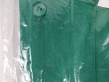 a close up of a green shirt in a plastic bag
