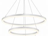 a white circular light fixture hanging from a ceiling