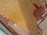 a close up of a toilet with a painting on it