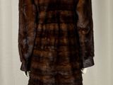 an image of a fur coat on a mannequin stand