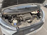 a car with its hood open and the engine in the back