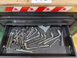 a drawer full of wrenches and other tools in it