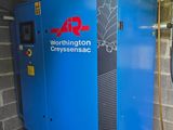a blue machine that is sitting in a room